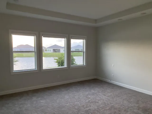 a view of a hallway with a bathroom