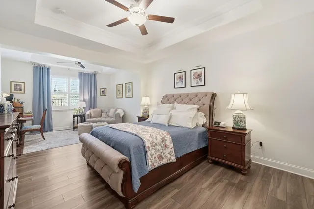 a bathroom with a sink a toilet and shower curtain