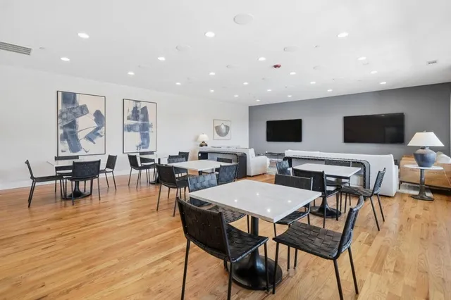 a view of a gym with lounge chair