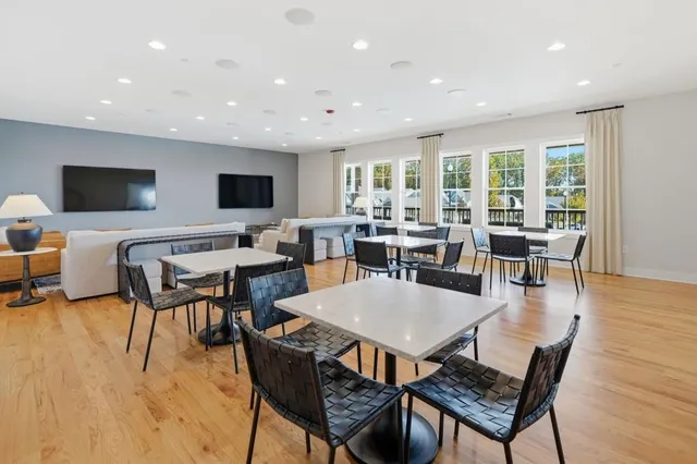 a view of a swimming pool with lake and mountain view