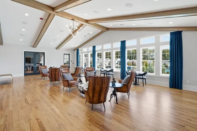 an aerial view of swimming pool patio and mountain view in back
