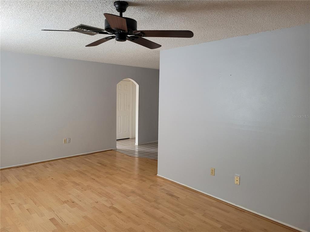 7809 Rusty Oak Drive New Port Richey, FL 34653 - Photo 4 of 24 Living Room Leads To Dinnette Area