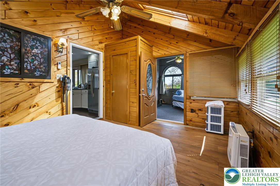 1605 Ridgeview Drive Lake Ariel, PA 18436 - Photo 16 of 40 Rich wood planking and sloped ceilings define this warm, rustic bedroom.
