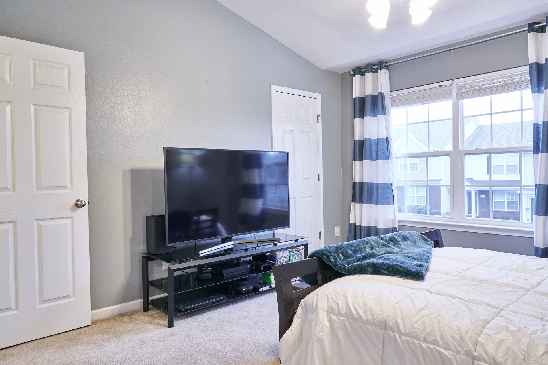 1924 Shaylin Loop Antioch, TN 37013 - Photo 20 of 22 a bedroom with a bed and a flat screen tv