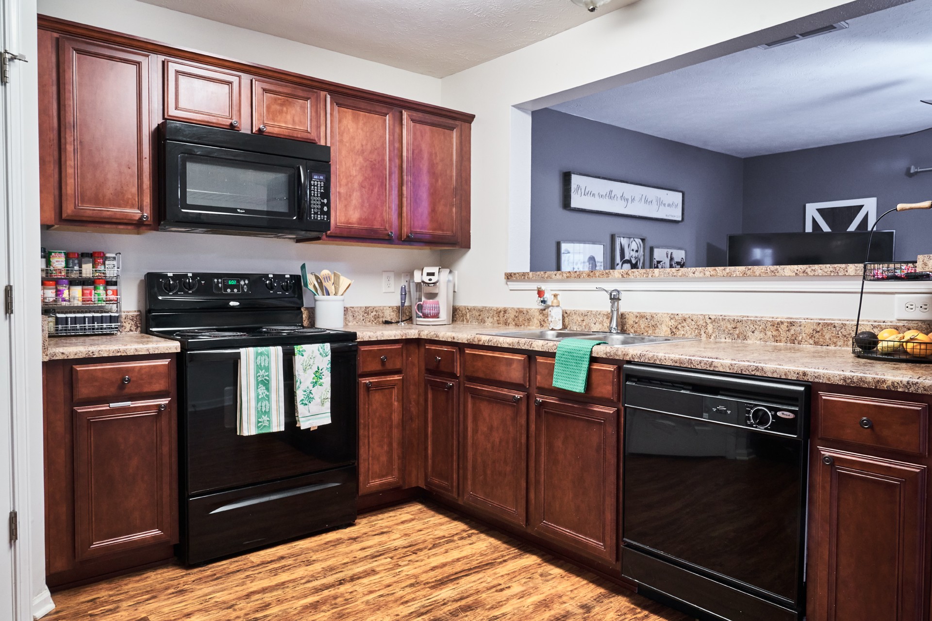 1924 Shaylin Loop Antioch, TN 37013 - Photo 9 of 22 a kitchen with granite countertop a stove top oven microwave and cabinets