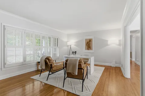 a view of a livingroom with furniture and wooden floor