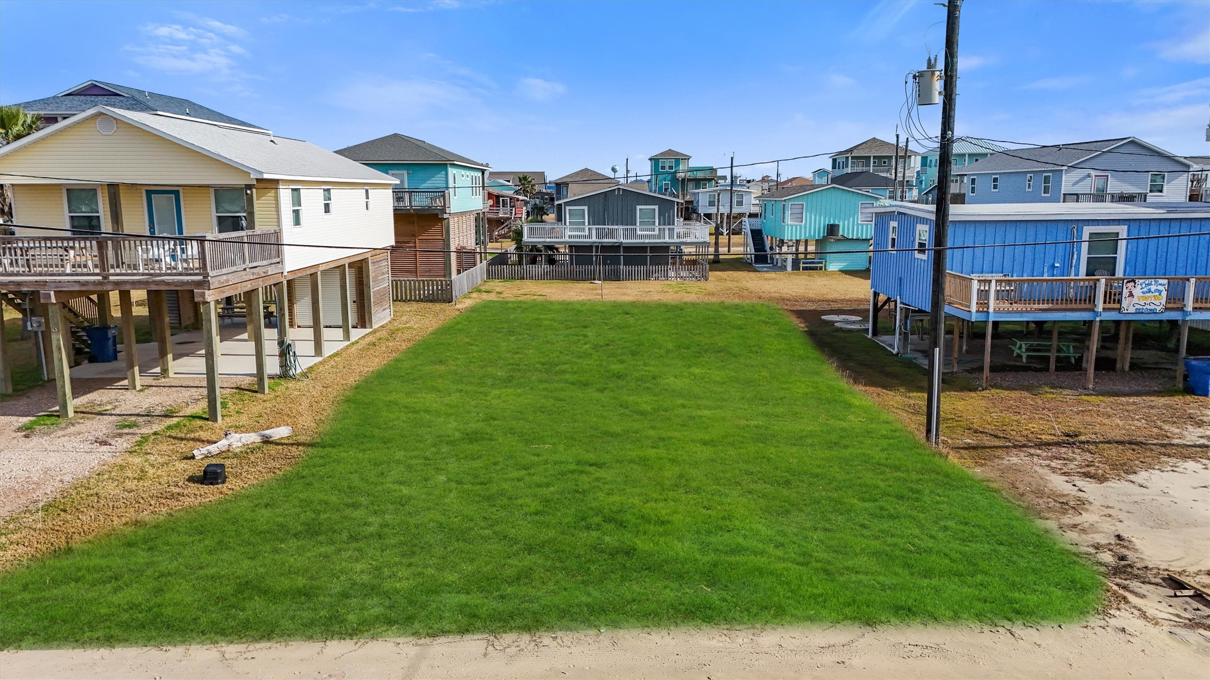 0 Ocean Avenue Surfside Beach, TX 77541 - Photo 9 of 19 a front view of a house with a yard