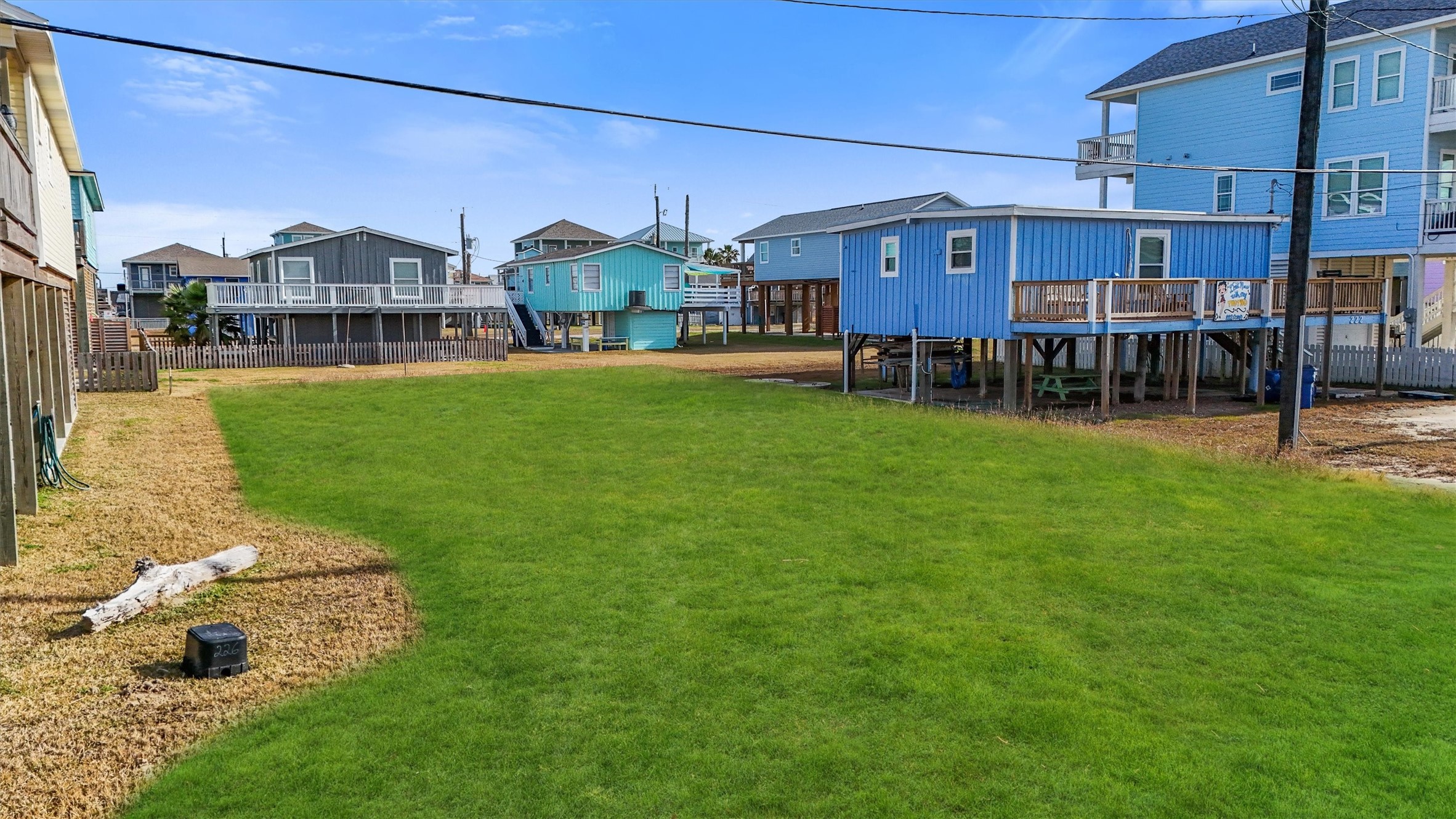 0 Ocean Avenue Surfside Beach, TX 77541 - Photo 10 of 19 a view of a big house with a big yard and large trees