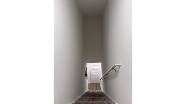 a view of a hallway with furniture