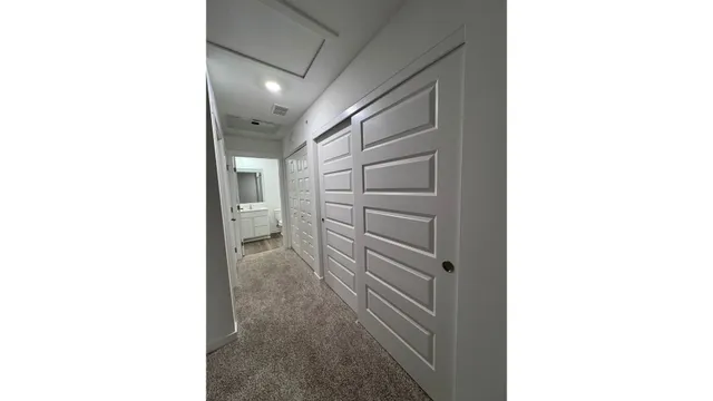 a view of a hallway with storage