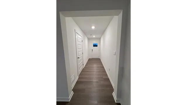 a view of a hallway with a white walls