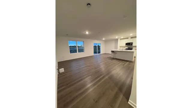 a view of a kitchen with a sink and a window