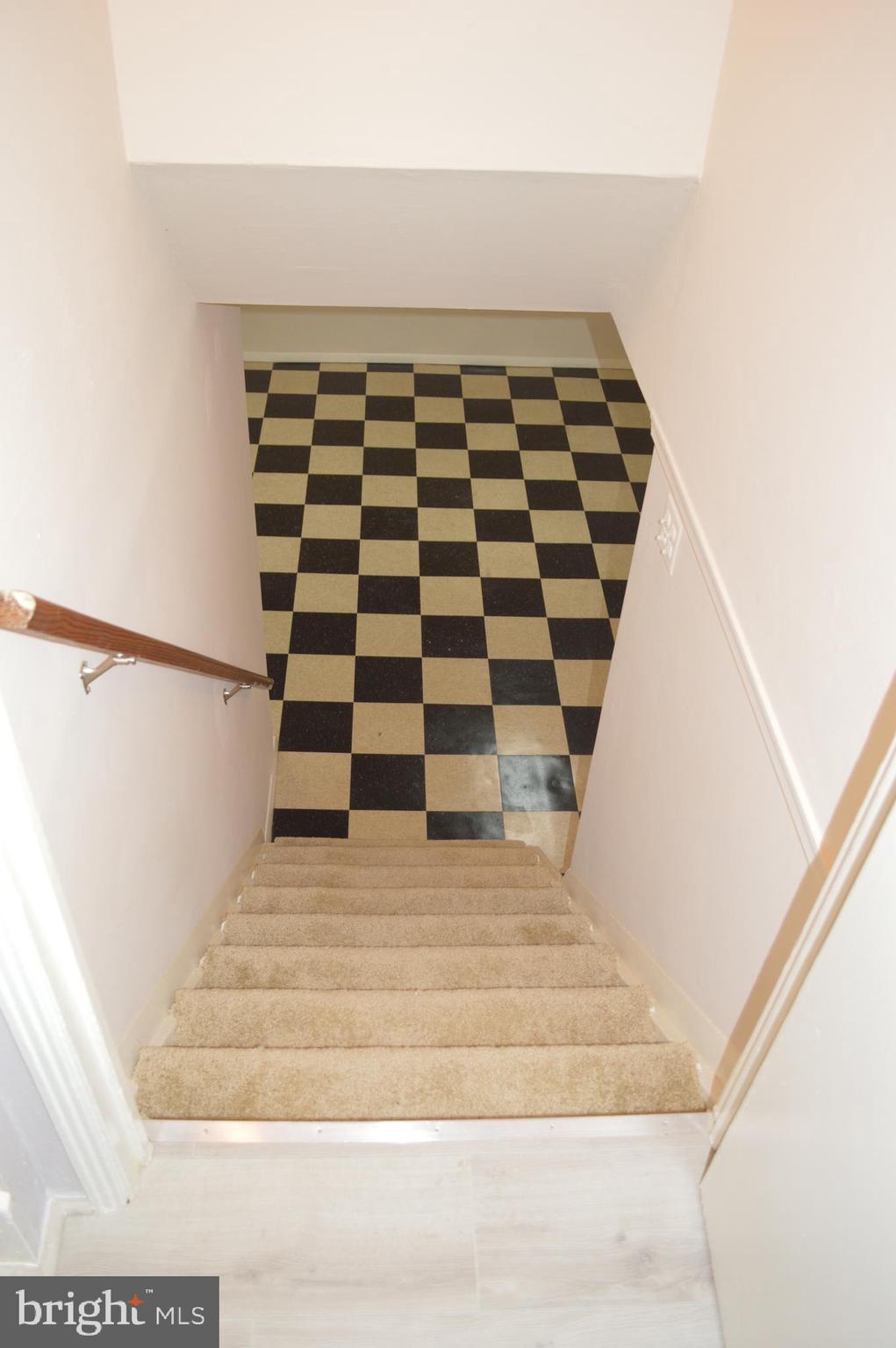 4712 Edgewood Road College Park, MD 20740 - Photo 25 of 45 Stairwell with carpeting to lower level