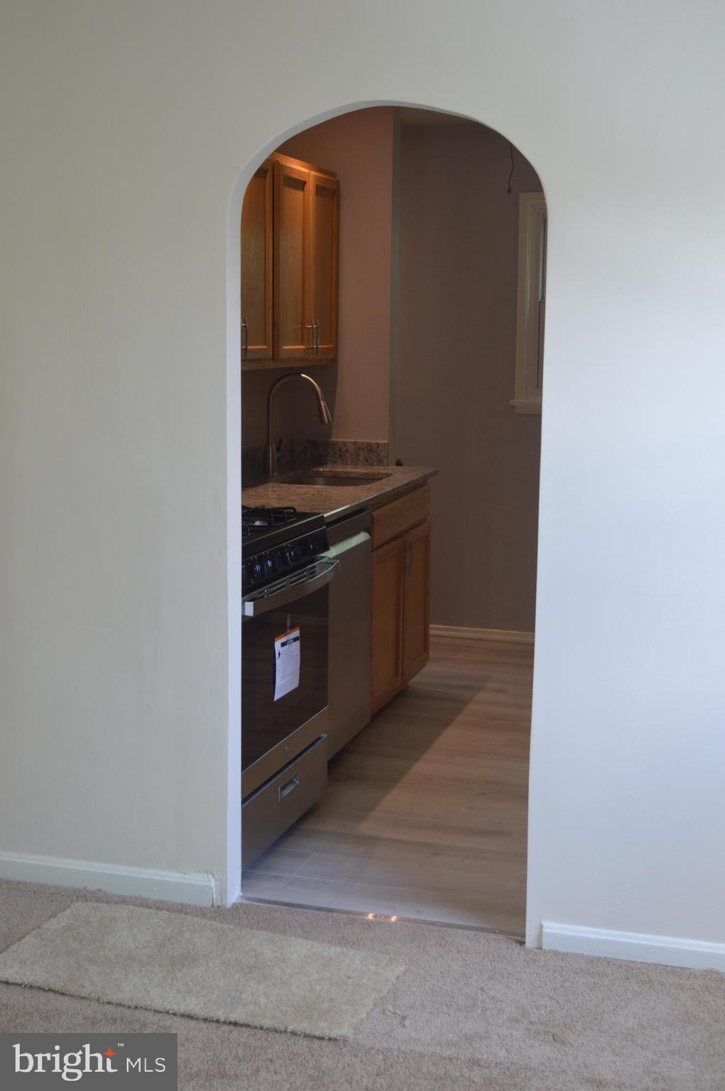 4712 Edgewood Road College Park, MD 20740 - Photo 6 of 45 Arch doorway from living room to kitchen
