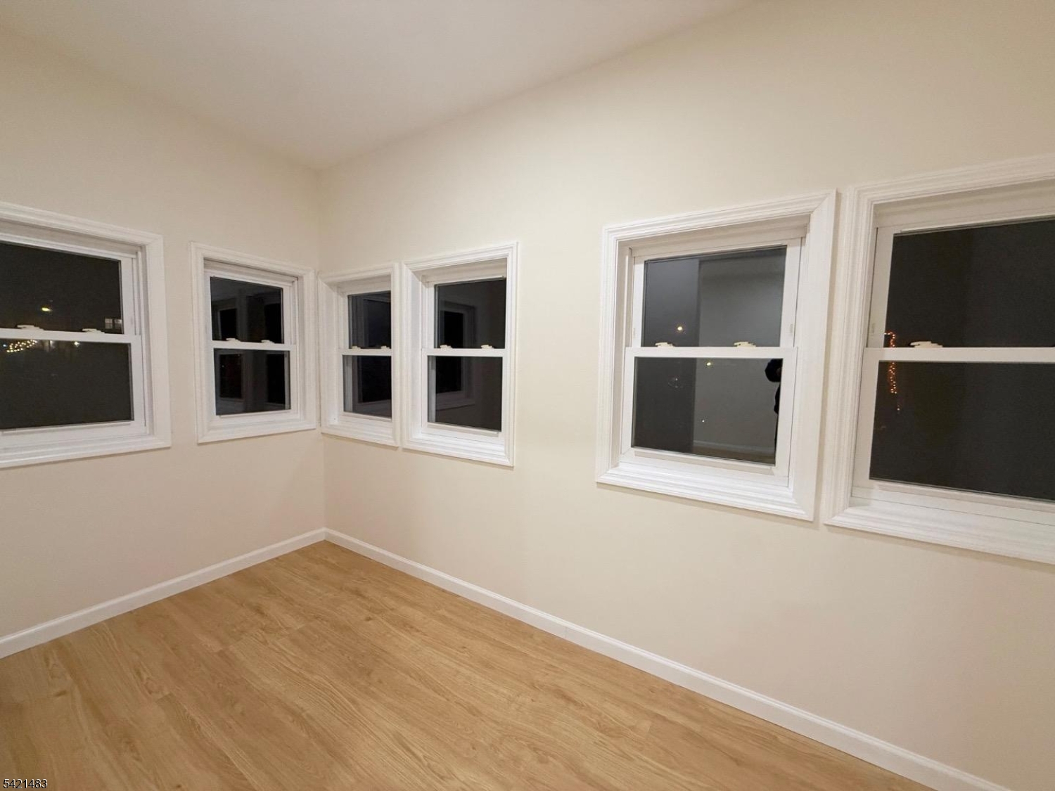 356 Carnegie Place, Unit 1 Union, NJ 07088 - Photo 2 of 10 a view of empty room with wooden floor