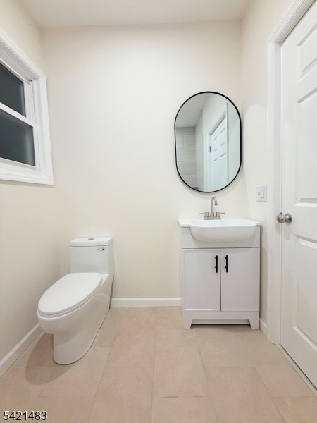 356 Carnegie Place, Unit 1 Union, NJ 07088 - Photo 7 of 10 a bathroom with a toilet sink and mirror