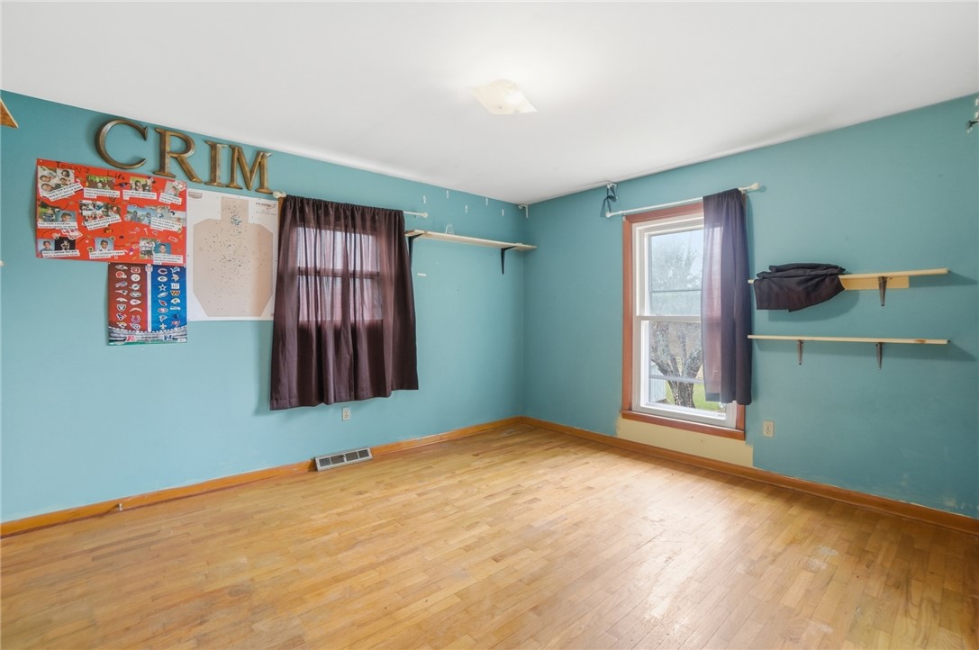290 Ginghamsburg Road Tipp City, OH 45371 - Photo 21 of 49 This bright room features durable hardwood flooring and natural light through its classic window.