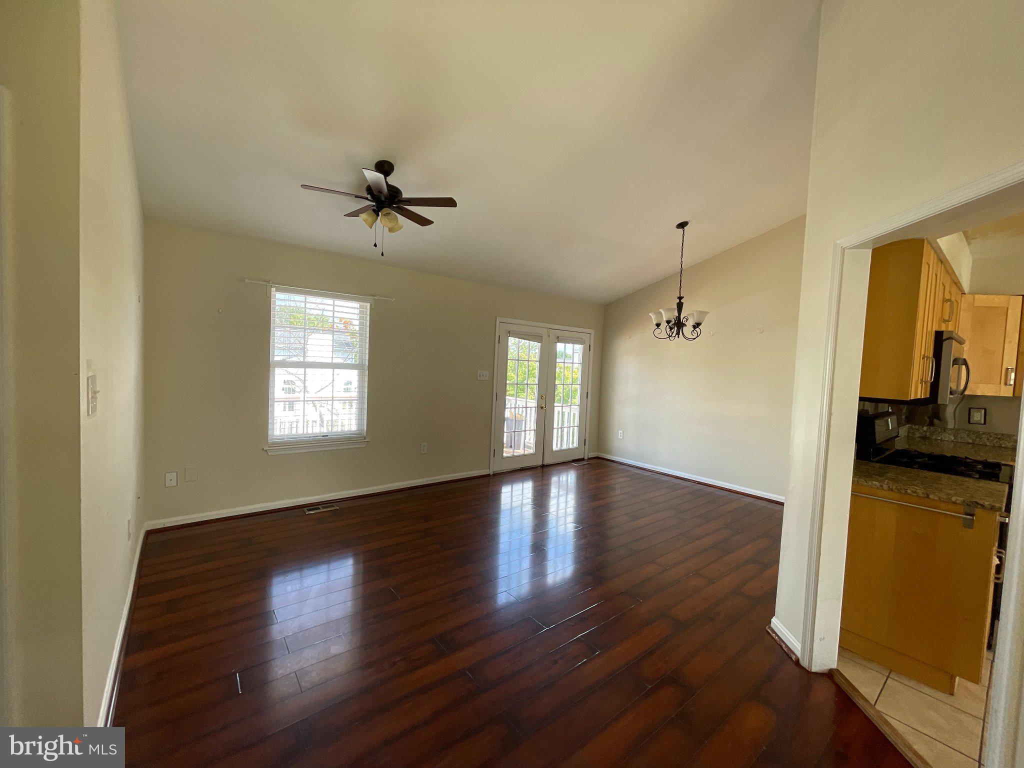 14319 Raddock Court Woodbridge, VA 22193 - Photo 3 of 12 Living room and dining area.