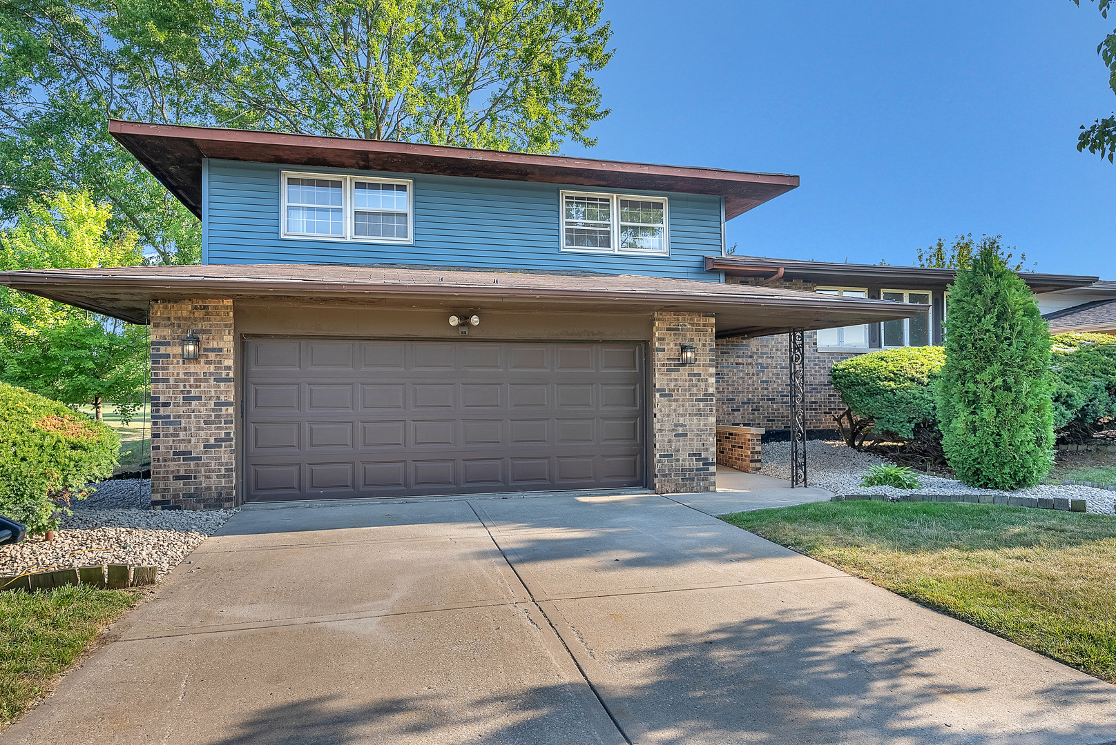 2957 192nd Place Lansing, IL 60438 - Photo 1 of 25 a front view of a house with a yard and garage