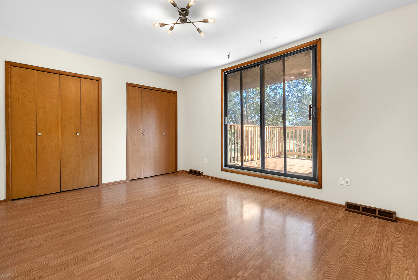2957 192nd Place Lansing, IL 60438 - Photo 11 of 25 a view of an empty room with wooden floor and a window