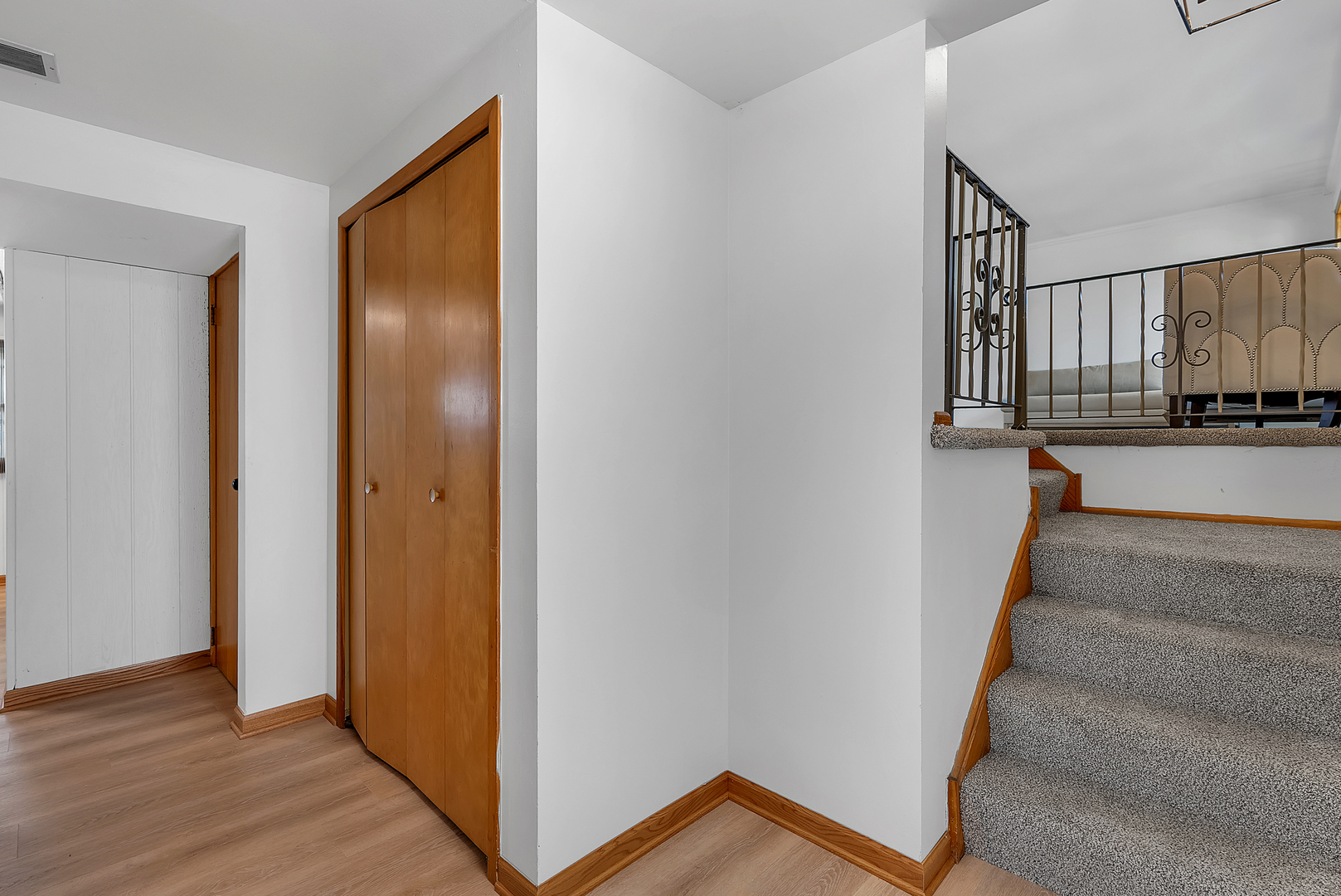 2957 192nd Place Lansing, IL 60438 - Photo 17 of 25 a view of a hallway with wooden floor and staircase