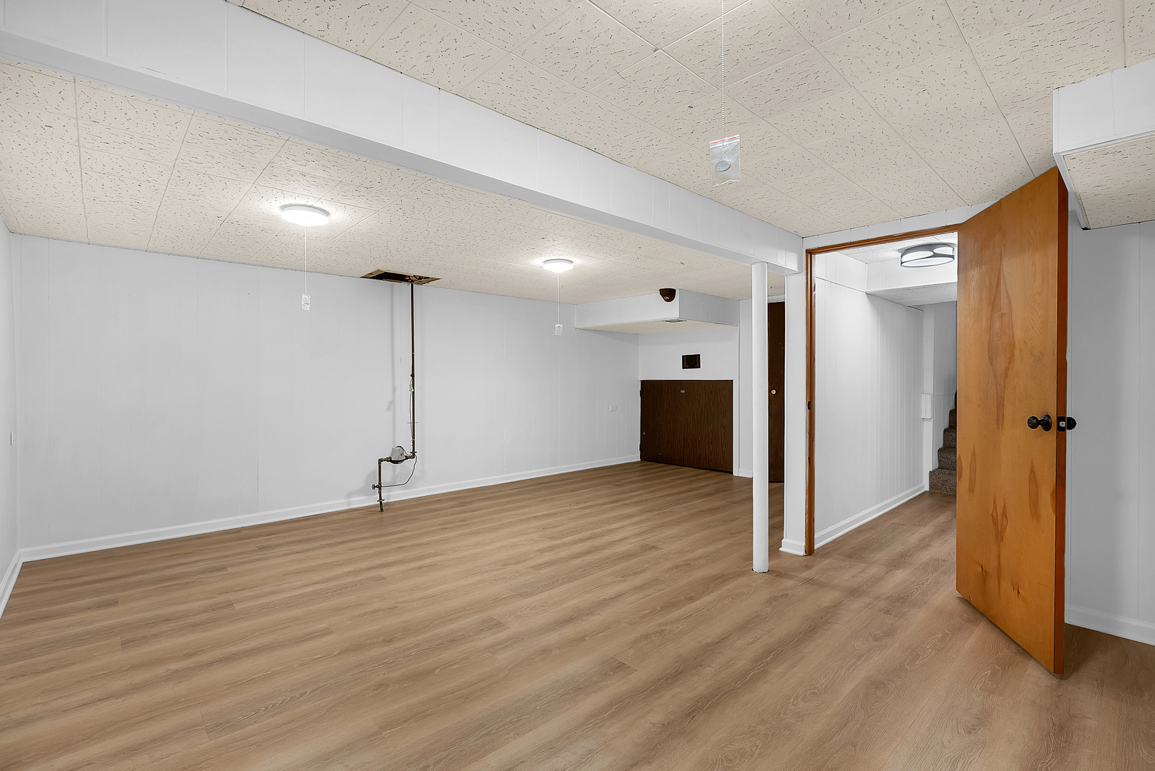 2957 192nd Place Lansing, IL 60438 - Photo 21 of 25 a view of an empty room with wooden floor and closet area