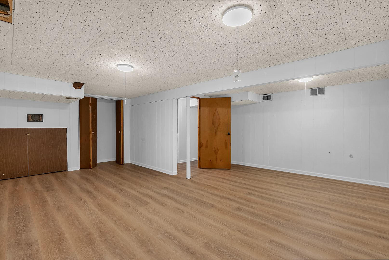 2957 192nd Place Lansing, IL 60438 - Photo 22 of 25 a view of an empty room with wooden floor