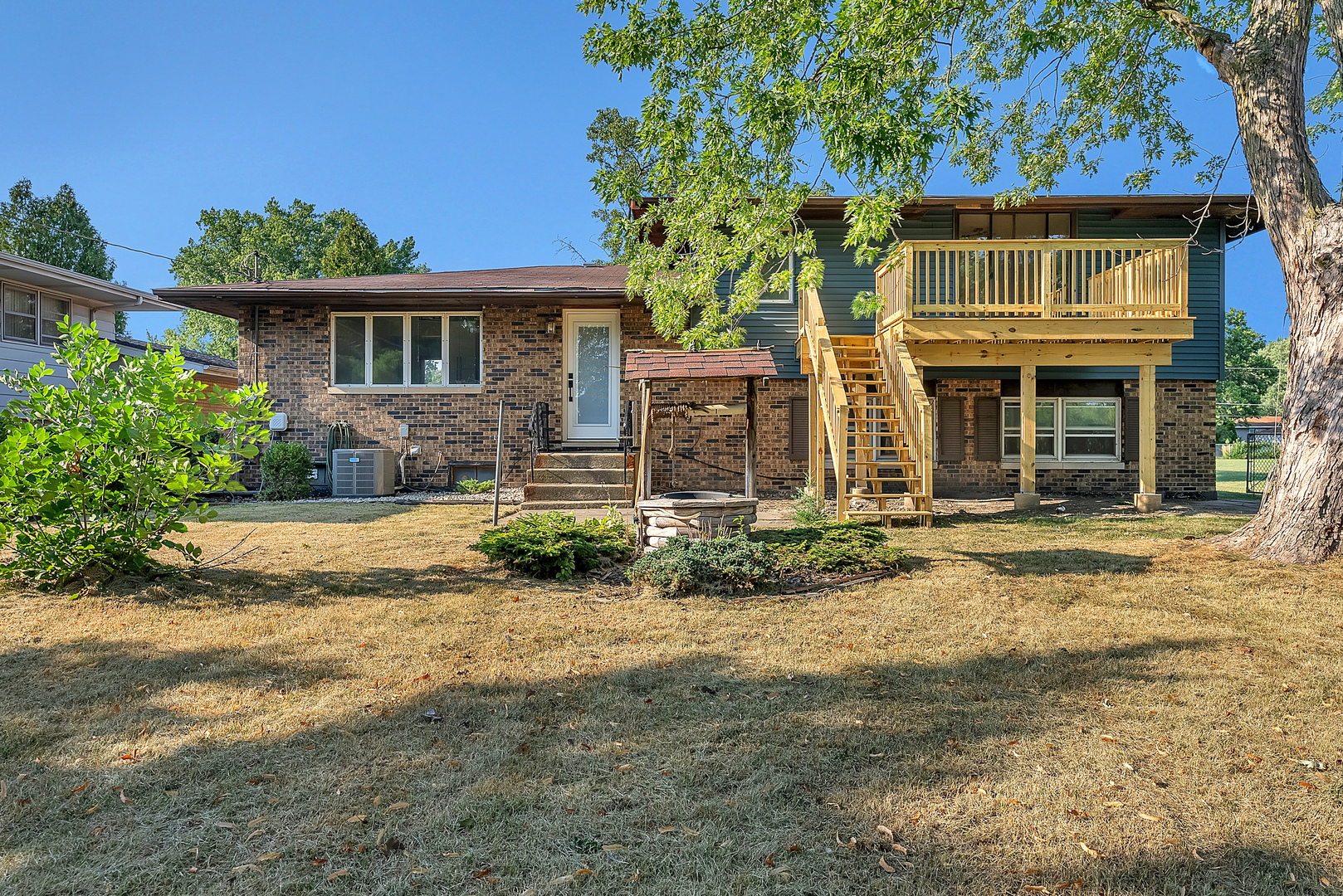2957 192nd Place Lansing, IL 60438 - Photo 25 of 25 a front view of a house with a yard and potted plants