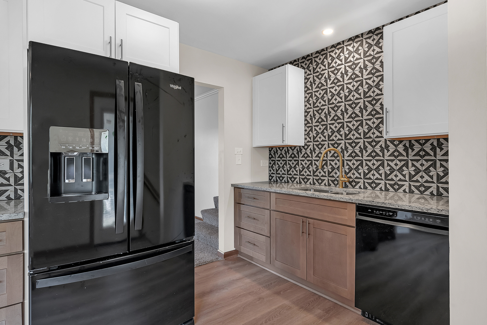 2957 192nd Place Lansing, IL 60438 - Photo 7 of 25 a kitchen with granite countertop a refrigerator and a sink