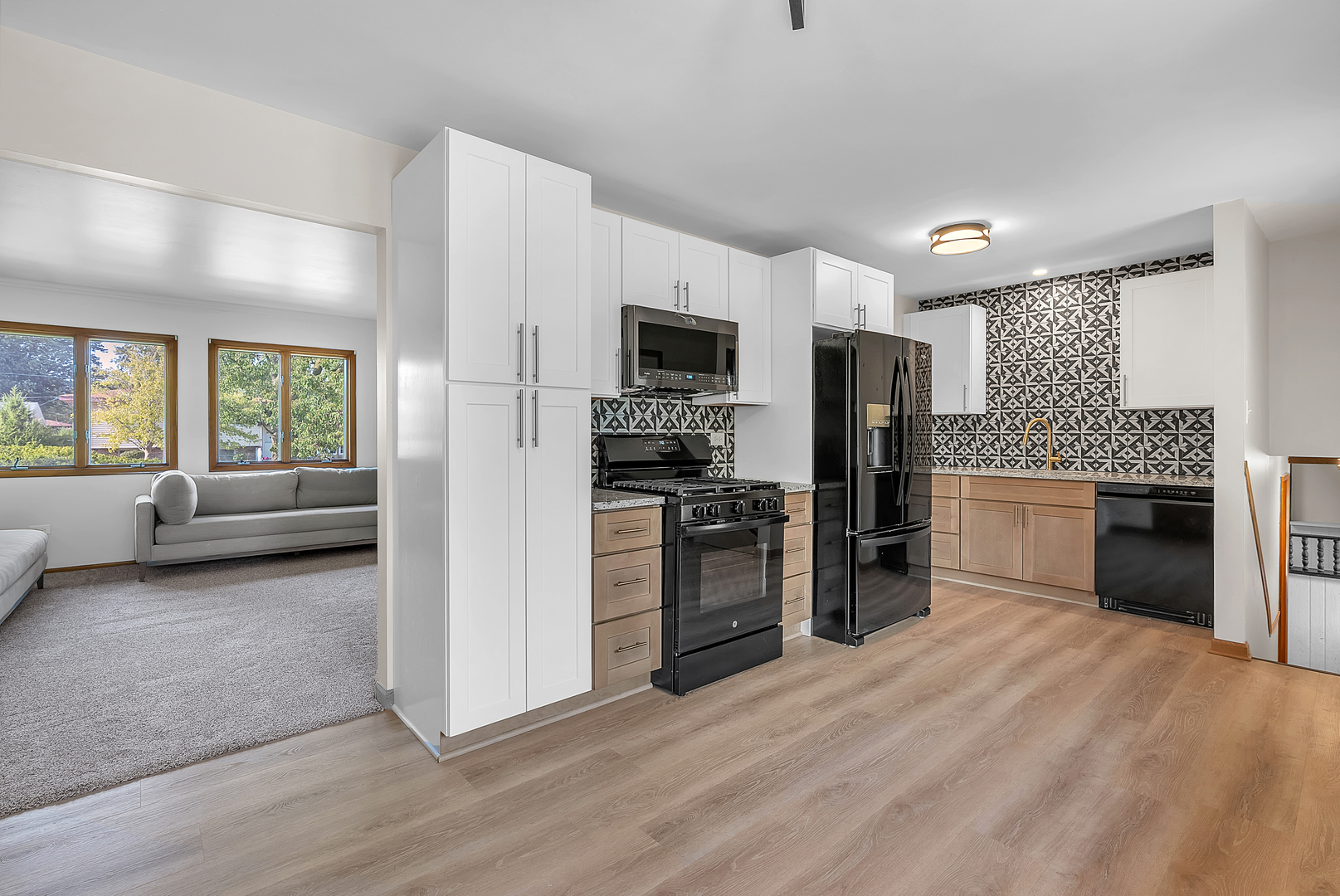 2957 192nd Place Lansing, IL 60438 - Photo 8 of 25 a kitchen with a refrigerator and a stove top oven