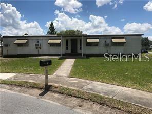 6945 Mediterranean Road Orlando, FL 32822 - Photo 1 of 1 a view of a backyard with a garden and plants