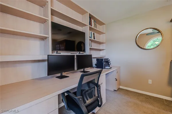 a view of a workspace with furniture
