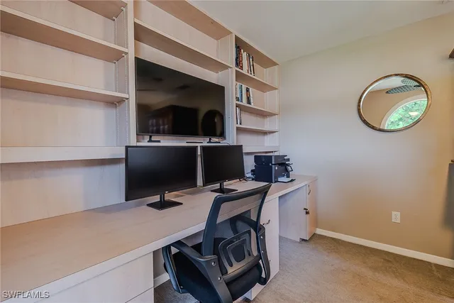 a view of a workspace with furniture