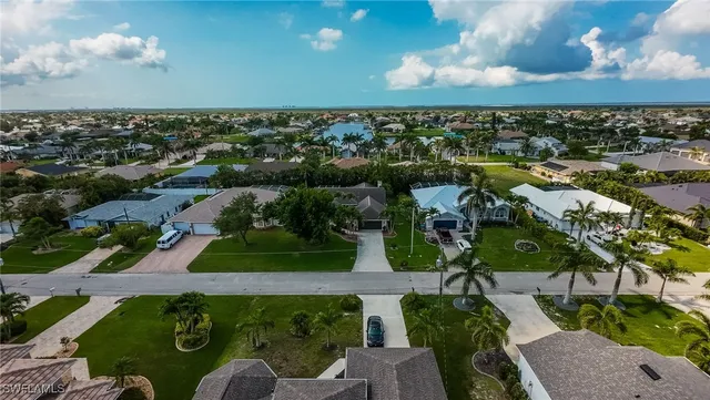 an aerial view of a house with a garden