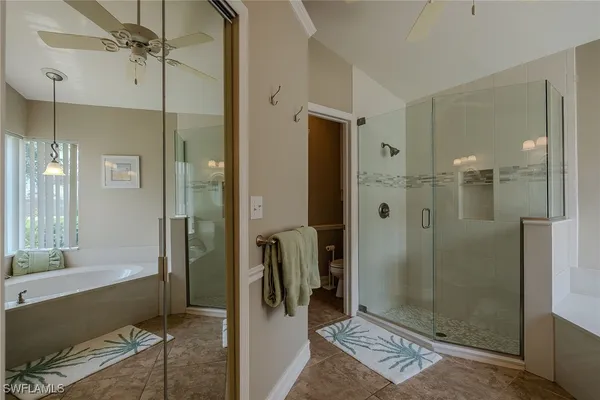 a bathroom with a shower and a sink