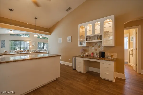 a kitchen with stainless steel appliances granite countertop a stove and a sink