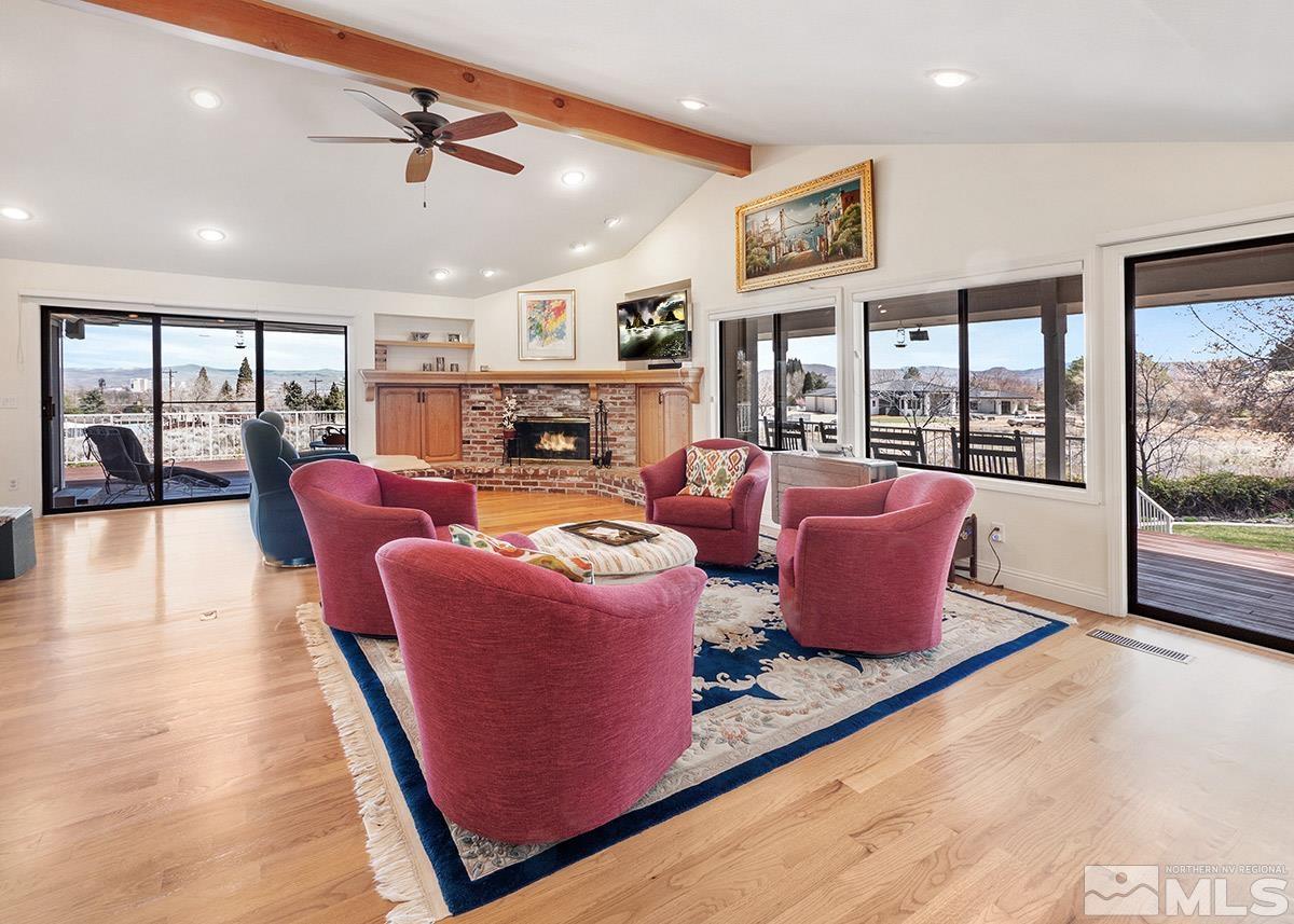 2215 Hedgewood Drive Reno, NV 89509 - Photo 13 of 39 a living room with furniture a floor to ceiling window and flat screen tv