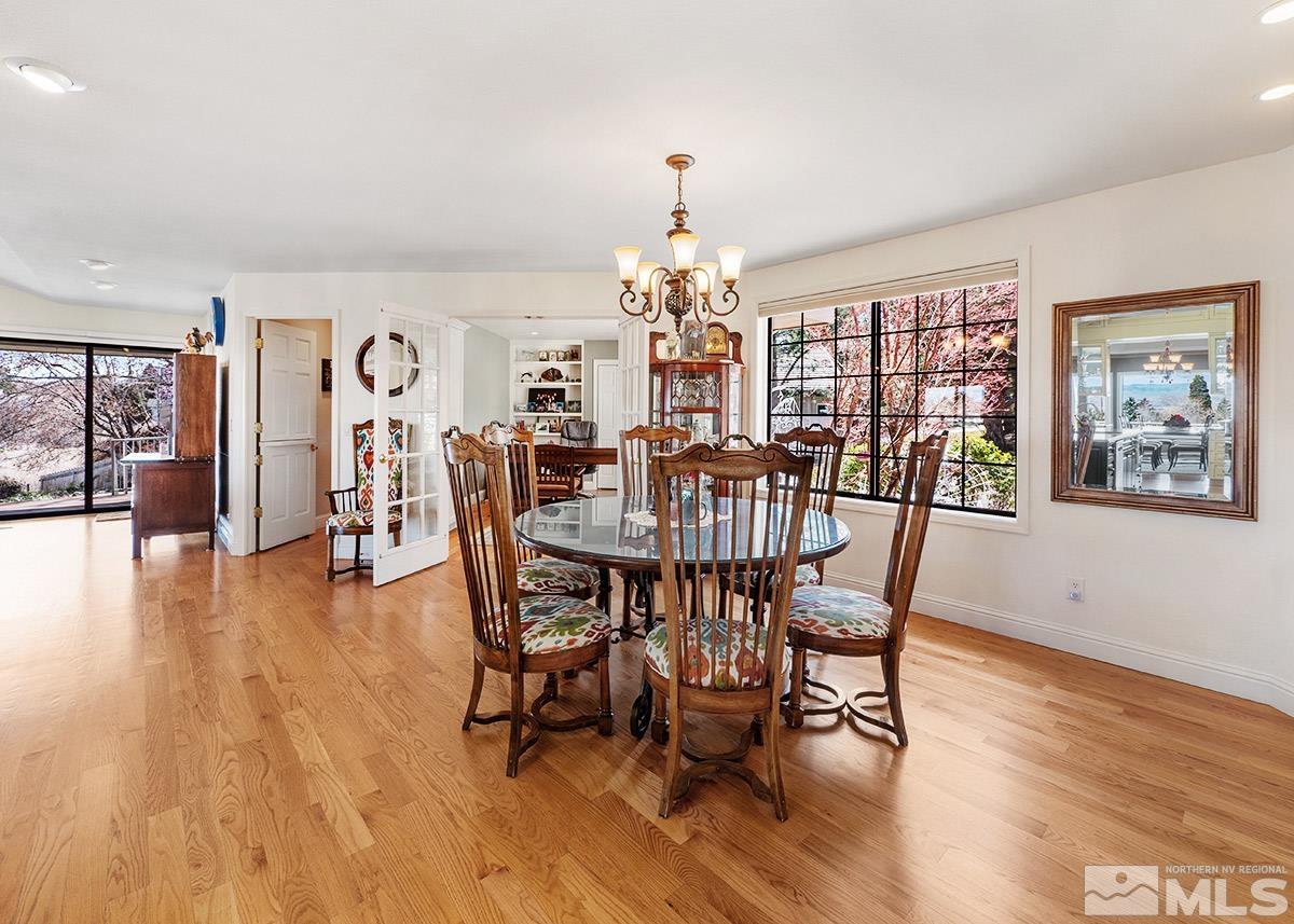 2215 Hedgewood Drive Reno, NV 89509 - Photo 15 of 39 a view of a dining room with furniture window and wooden floor