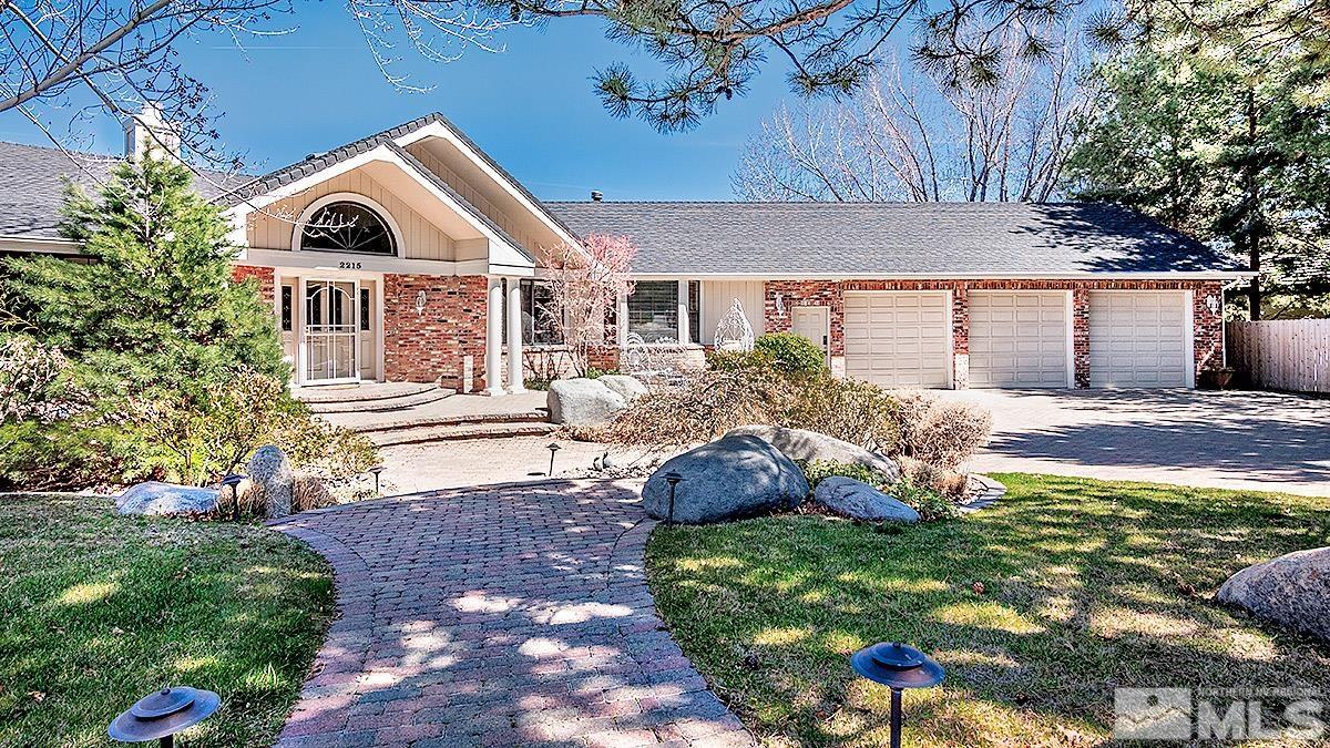 2215 Hedgewood Drive Reno, NV 89509 - Photo 2 of 39 a front view of a house with a yard