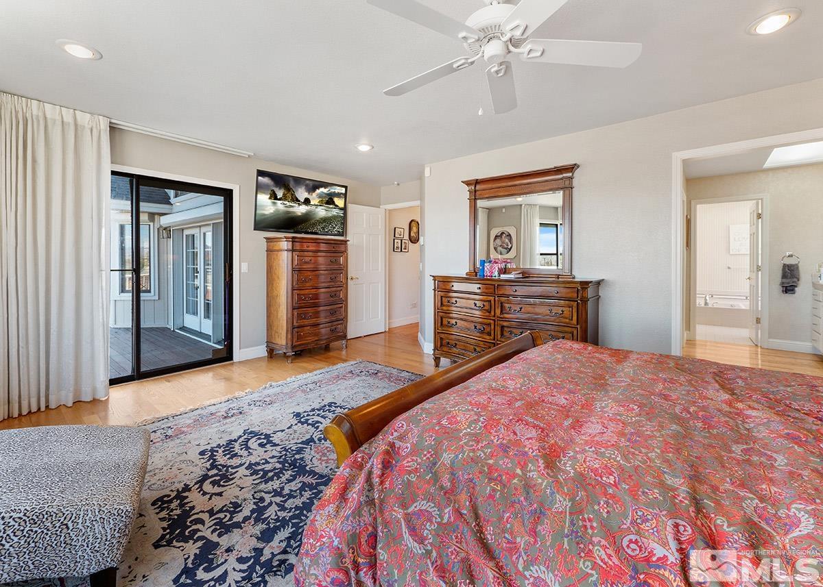 2215 Hedgewood Drive Reno, NV 89509 - Photo 23 of 39 a bedroom with a large bed and dresser