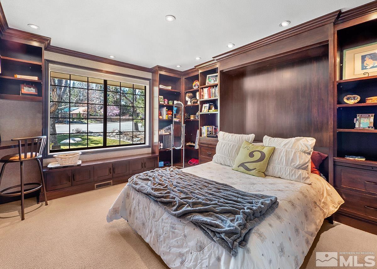 2215 Hedgewood Drive Reno, NV 89509 - Photo 26 of 39 a bedroom with a large bed and a large window