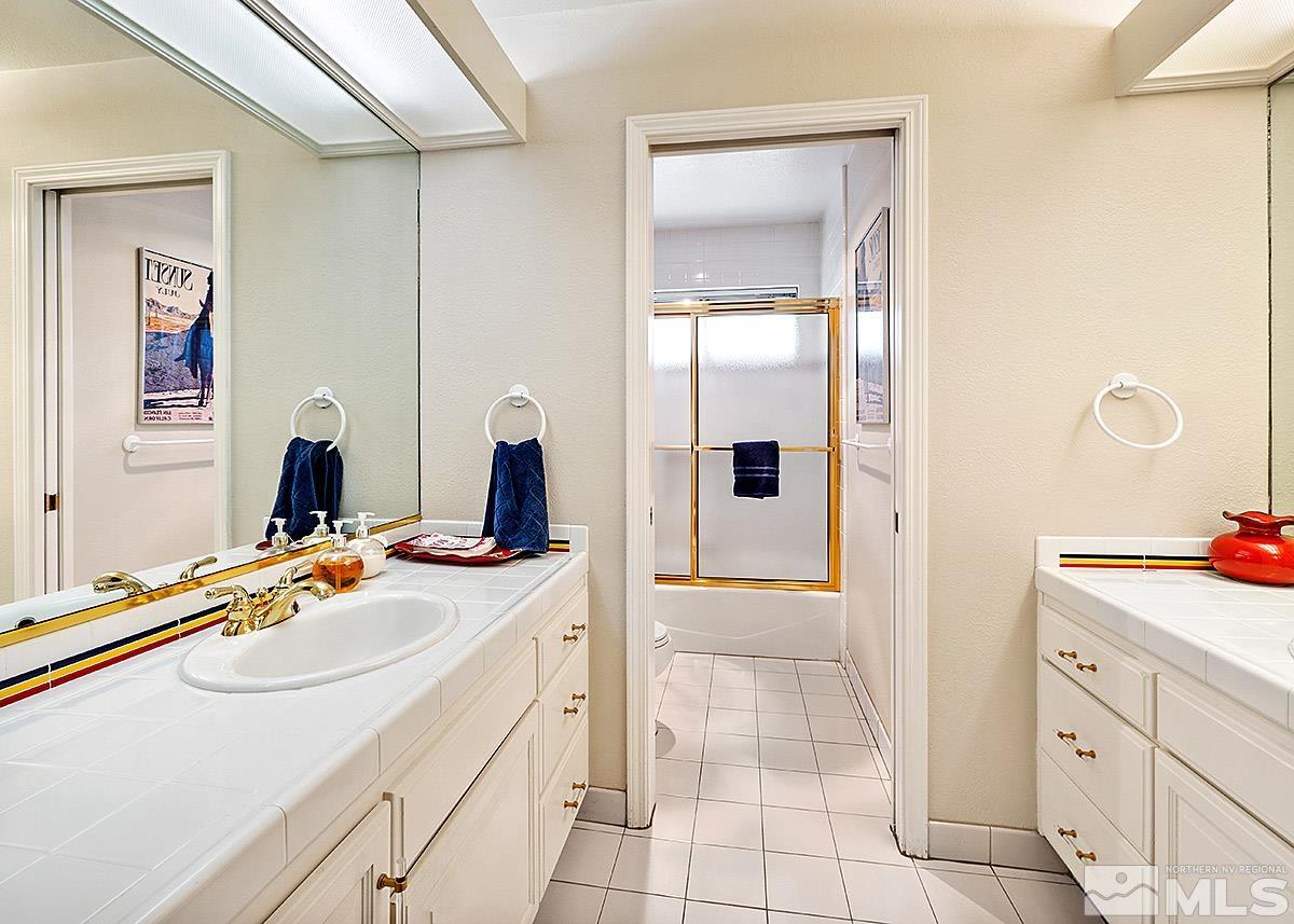 2215 Hedgewood Drive Reno, NV 89509 - Photo 27 of 39 a bathroom with a sink double vanity and a mirror