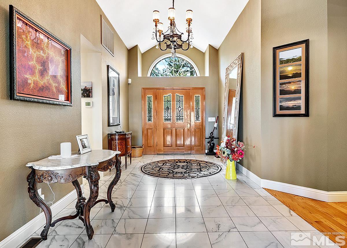 2215 Hedgewood Drive Reno, NV 89509 - Photo 3 of 39 a view of a dining room with furniture window and wooden floor