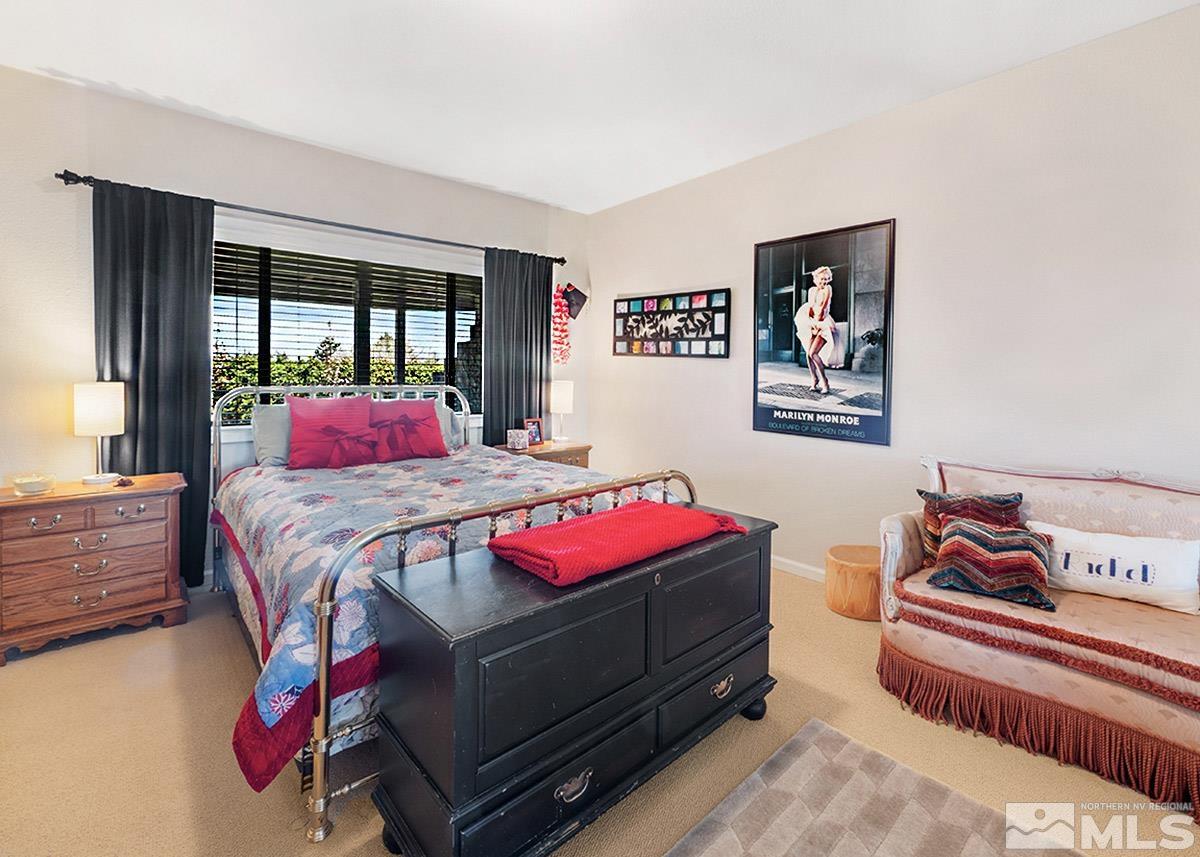 2215 Hedgewood Drive Reno, NV 89509 - Photo 32 of 39 a bedroom with a bed and wooden floor