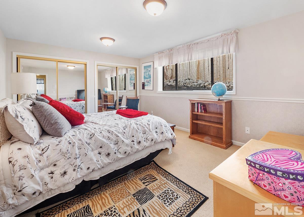 2215 Hedgewood Drive Reno, NV 89509 - Photo 33 of 39 a bedroom with bed and window