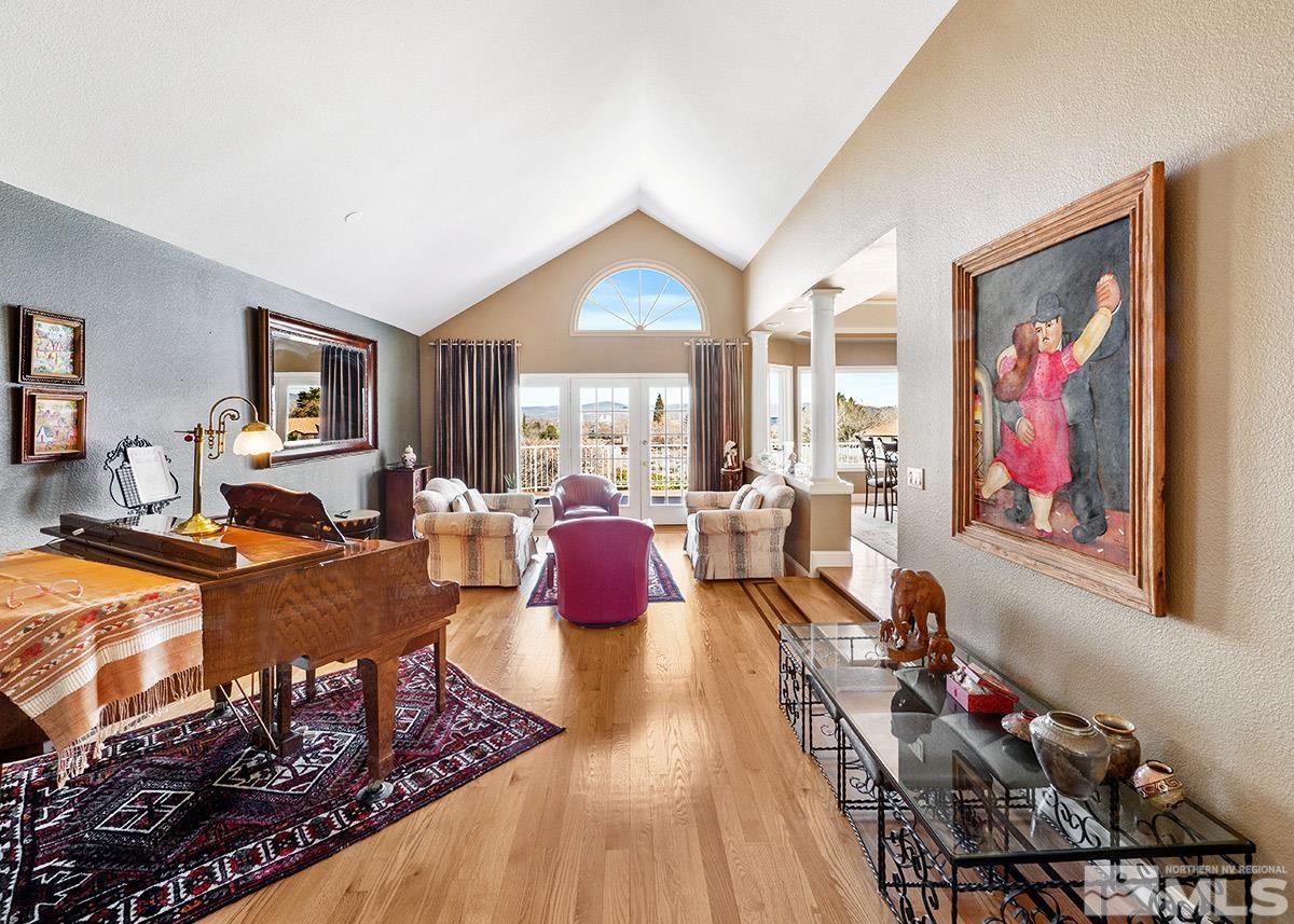 2215 Hedgewood Drive Reno, NV 89509 - Photo 4 of 39 a living room with furniture a dining table and a piano table