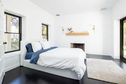 a bedroom with a bed and window