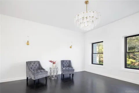 a view of a livingroom with furniture and window