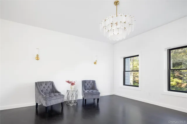 a view of a livingroom with furniture and window