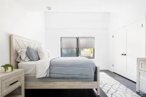a bathroom with a sink mirror and toilet